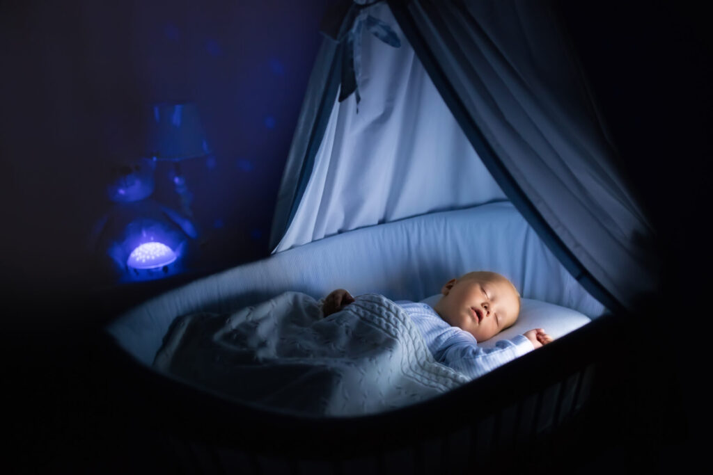 a baby sleeping in a crib
